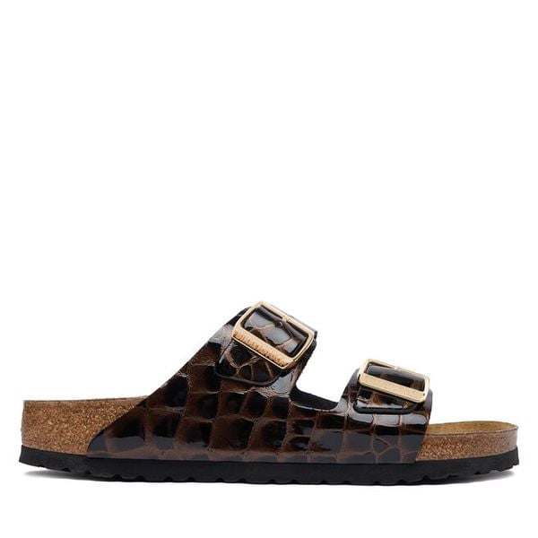 Klapki Birkenstock. Czarne klapki damskie Birkenstock, bez wzorów, bez obcasa. Za 674.99 zł.