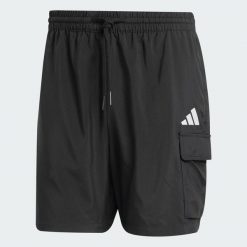 Szorty Essentials Small Logo Cargo Chelsea. Brązowe krótkie spodenki sportowe męskie Adidas, xs, bez wzorów, z materiału, na fitness i siłownię. Za 179.00 zł.