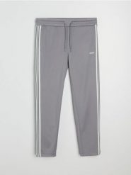 Spodnie dresowe z ozdobnymi taśmami po boku - szary. Szare spodnie sportowe męskie Sinsay, l, bez wzorów, z dresówki, na fitness i siłownię. Za 59.99 zł.