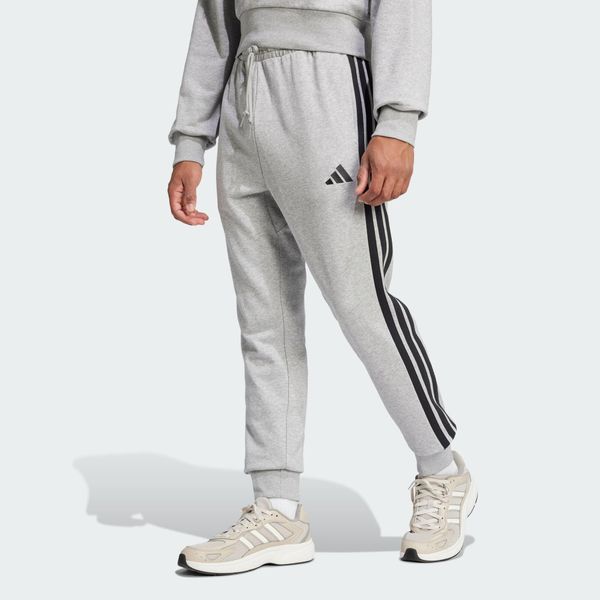 Spodnie Essential 3-Stripes French Terry. Czarne buty sportowe męskie Adidas, bez wzorów, z materiału. Za 219.00 zł.