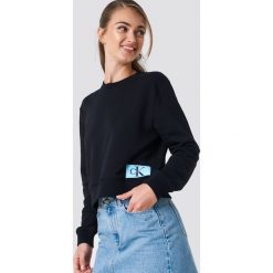 Calvin Klein Bluza Monogram Logo Badge - Black. Czarne bluzy damskie Calvin Klein, z aplikacjami. Za 364.95 zł.