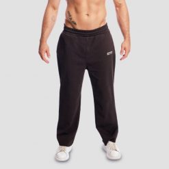 Spodnie dresowe męskie oversize brązowe Aura. Brązowe spodnie sportowe męskie GYMBEAM, m, bez wzorów, z bawełny, na fitness i siłownię. Za 139.90 zł.