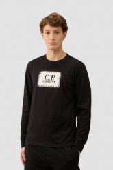 C.P. COMPANY Czarny męski longsleeve. Czarne bluzki z długim rękawem męskie C.P. Company, l, bez wzorów, bez kołnierzyka. W wyprzedaży za 349.99 zł.