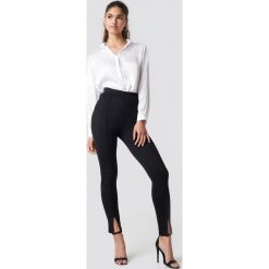 NA-KD Spodnie z detalem z przodu - Black. Czarne spodnie materiałowe damskie marki NA-KD. Za 141.95 zł.