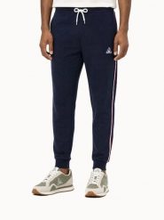 Spodnie Le Coq Sportif Tri SP. Niebieskie spodnie sportowe męskie le coq sportif, s, bez wzorów, z materiału, na fitness i siłownię. Za 406.00 zł.