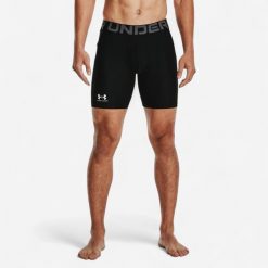 Spodenki męskie Under Armour HeatGear® kompresyjne. Czarne krótkie spodenki sportowe męskie Under Armour, l, bez wzorów, z materiału, na fitness i siłownię. Za 119.99 zł.
