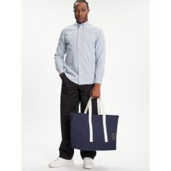 Torebka Tommy Hilfiger. Niebieskie torebki do ręki damskie Tommy Hilfiger, bez wzorów, bez dodatków. Za 269.99 zł.