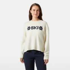 Damski sweter z dzianiny Helly Hansen Bliss. Białe swetry damskie Helly Hansen, na zimę, bez wzorów, z dzianiny, sportowe, bez kołnierzyka, bez ramiączek, bez kaptura. Za 701.00 zł.