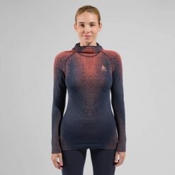 Koszulka termoaktywna z długim rękawem i kominiarką damska Odlo BLACKCOMB ECO. Niebieskie koszulki sportowe damskie Odlo, s, bez wzorów, z elastanu, bez kołnierzyka, bez ramiączek, do biegania. Za 529.99 zł.