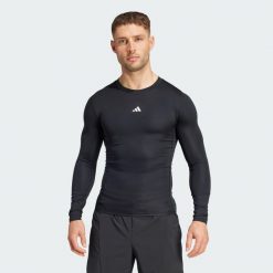 Koszulka TECHFIT Compression Training Long Sleeve. Czarne buty sportowe męskie Adidas, z materiału, bez zapięcia, na fitness i siłownię, techfit (adidas). Za 179.00 zł.