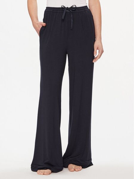 Tommy Hilfiger Spodnie dresowe UW0UW05195 Granatowy Relaxed Fit. Niebieskie spodnie dresowe damskie Tommy Hilfiger, xs, bez wzorów, z dresówki. Za 209.99 zł.