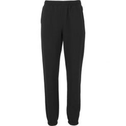 Damskie spodnie dresowe Athlecia Ruthie. Czarne spodnie sportowe damskie Athlecia, bez wzorów, z bawełny, do biegania. Za 164.00 zł.