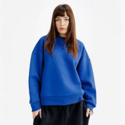 Bluza okrągły dekolt damska Elementals. Niebieskie bluzy damskie Decathlon, m, bez wzorów, z bawełny, bez kaptura. Za 149.99 zł.