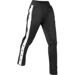 Spodnie sportowe, z rozpinanymi nogawkami, długie bonprix czarny. Spodnie dresowe damskie marki bonprix. Za 89.99 zł.