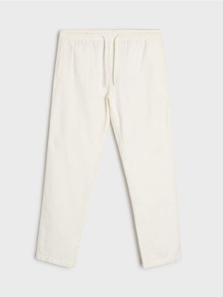 Spodnie chino jogger - kremowy. Białe spodnie materiałowe męskie Sinsay, bez wzorów. Za 69.99 zł.