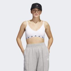 Adidas Purebare Light-Support Bra. Białe obuwie sportowe damskie Adidas, bez wzorów, na fitness i siłownię. W wyprzedaży za 126.95 zł.