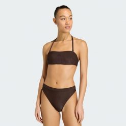 Prążkowany top od bikini z wkładkami bandeau Iconisea. Brązowe bikini damskie Adidas, bez wzorów, z elastanu, bez kołnierzyka, bez ramiączek. Za 179.00 zł.