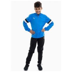 Dres treningowy chłopięcy Puma 65865502. Niebieskie spodnie sportowe dla chłopców Puma, bez wzorów, z dresówki, sportowe, na jogę i pilates. Za 200.00 zł.
