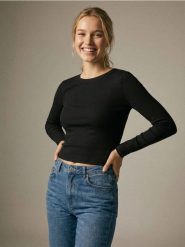 Koszulka z długim rękawem basic - czarny. Czarne t-shirty damskie Sinsay, l, bez wzorów, bez kołnierzyka. Za 19.99 zł.