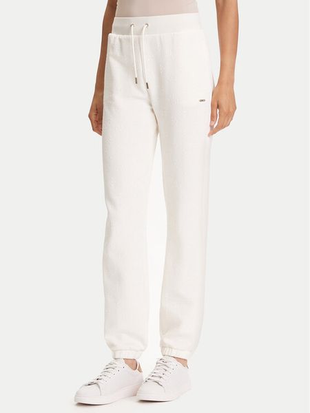 Guess Spodnie dresowe V5YB06 KBSL2 Écru Regular Fit. Białe spodnie dresowe damskie Guess, s, z aplikacjami, z dresówki. Za 199.99 zł.