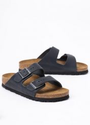 Klapki damskie BIRKENSTOCK ARIZONA LEOI. Brązowe klapki damskie Birkenstock, bez wzorów, biznesowe, bez obcasa. Za 439.99 zł.