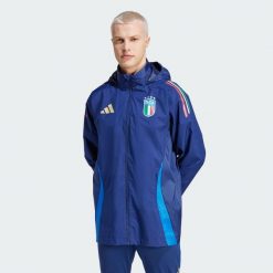 Kurtka Italy Tiro 24 Competition All-Weather. Niebieskie kurtki męskie Adidas, s, bez wzorów, z materiału, sportowe, bez kaptura. W wyprzedaży za 372.80 zł.