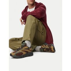 Buty do biegania Reebok. Brązowe buty sportowe męskie Reebok, bez zapięcia, do biegania. Za 359.99 zł.