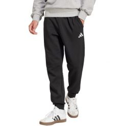 Spodnie męskie adidas Essentials Feelcozy. Czarne buty sportowe męskie Adidas, z bawełny, bez zapięcia, na fitness i siłownię. Za 171.99 zł.