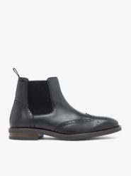 Czarne ocieplane sztyblety ze skóry licowej. Czarne botki męskie Ryłko, z aplikacjami, ze skóry, eleganckie, bez zapięcia. Za 649.99 zł.