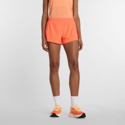 Spodenki damskie New Balance WS41286AAE – pomarańczowe. Brązowe szorty sportowe damskie New Balance, l, bez wzorów, z materiału, sportowe, na fitness i siłownię. Za 279.99 zł.