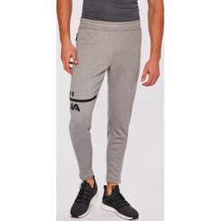 Under Armour - Spodnie. Szare spodnie sportowe męskie Under Armour, z dzianiny. W wyprzedaży za 199.90 zł.