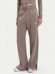 Nike Spodnie dresowe Phoenix DQ5615 Brązowy Regular Fit. Brązowe spodnie dresowe damskie Nike, m, bez wzorów, z bawełny. Za 259.99 zł.