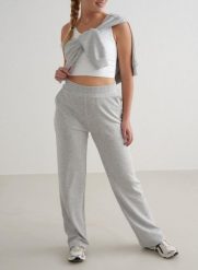 Damskie spodnie szerokie, wysoki stan, kieszenie Comfy Modal jasnoszary melanż. Szare spodnie materiałowe damskie Aim'n, xl, bez wzorów, z elastanu, na fitness i siłownię. Za 339.00 zł.