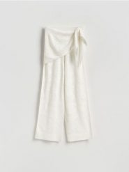 Spodnie z chustą - kremowy. Białe spodnie materiałowe damskie Reserved, l, bez wzorów, z dzianiny. Za 159.99 zł.