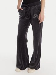 Guess Spodnie dresowe W6RB32 KCUF1 Granatowy Regular Fit. Niebieskie spodnie dresowe damskie Guess, xs, z aplikacjami, z bawełny. Za 389.99 zł.