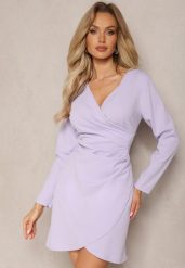 Fioletowa Kopertowa Sukienka Drapowana w Talii Ejorunna. Fioletowe sukienki damskie Renee, na imprezę, bez wzorów, eleganckie, bez kołnierzyka, bez ramiączek, mini, kopertowe. Za 59.99 zł.
