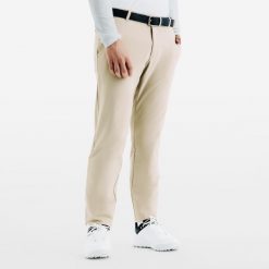 Spodnie do golfa męskie ciepłe CW500. Brązowe spodnie sportowe męskie INESIS, m, bez wzorów, z elastanu, na golfa, windstopper. Za 159.99 zł.