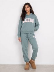 Bluza hoodie oversize z napisem - turkusowy. Niebieskie bluzy damskie Sinsay, l, bez wzorów, bez kaptura. Za 49.99 zł.
