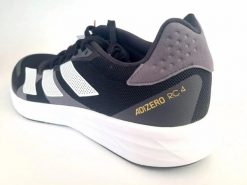 Damskie buty do biegania lekka konstrukcja ADIZERO RC 4 SHOES. Czarne obuwie sportowe damskie Adidas, bez wzorów, z gumy, do biegania. Za 428.45 zł.