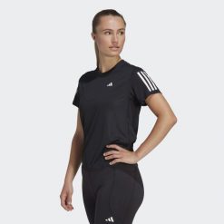 Koszulka do biegania damska Adidas Own the Run Tee. Czarne koszulki sportowe damskie Adidas, bez wzorów, z materiału, bez kołnierzyka, bez ramiączek, do biegania. Za 130.99 zł.