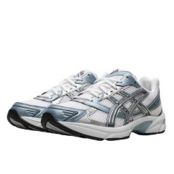 Buty do chodzenia dla dorosłych ASICS Gel-1130 White Shark Skin. Białe obuwie sportowe damskie Asics, bez wzorów, z materiału, do biegania. Za 837.99 zł.