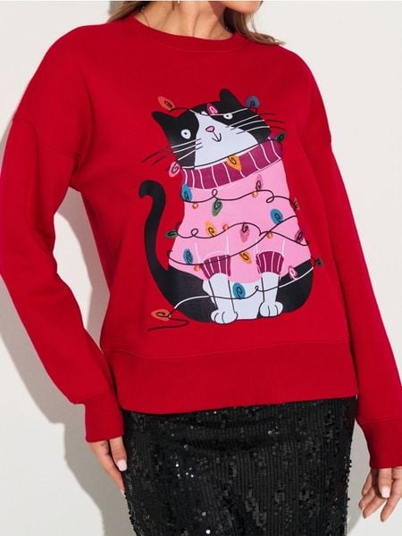 Bluza crewneck z motywem świątecznym - czerwony. Czerwone bluzy damskie Sinsay, l, bez wzorów, bez kaptura. Za 49.99 zł.