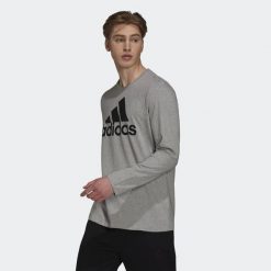 Koszulka adidas Essentials Long Sleeve. Czarne koszulki sportowe męskie Adidas, xs, bez wzorów, z bawełny, bez kołnierzyka, bez ramiączek, na fitness i siłownię. Za 149.00 zł.