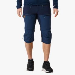Spodnie outdoor Wędrówki męskie Swedemount Lofoten Stretch 3/4 Pants wodoodporne. Niebieskie spodnie sportowe męskie SWEDEMOUNT, na lato, m, bez wzorów, z tkaniny, outdoorowe. Za 399.99 zł.