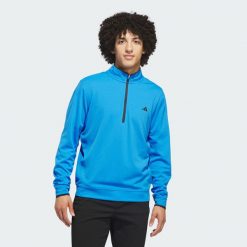 Koszulka Lightweight Half-Zip. Niebieskie koszulki sportowe męskie Adidas, uniwersalny, bez wzorów, z materiału, bez kołnierzyka, bez ramiączek, na golfa. Za 279.00 zł.