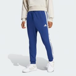 Spodnie Essential 3-Stripes French Terry. Białe spodnie sportowe męskie Adidas, s, bez wzorów, z bawełny, na fitness i siłownię. Za 267.99 zł.