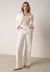 Białe Szerokie Jeansy z Bawełny z Asymetrycznym Zapięciem Saphisia. Białe jeansy damskie Born2be. Za 139.99 zł.