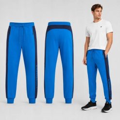 SPODNIE MĘSKIE DRESOWE 4F JOGGERY SPORTOWE NIEBIESKIE. Niebieskie spodnie sportowe męskie 4f, m, bez wzorów, z bawełny, na fitness i siłownię. Za 159.99 zł.