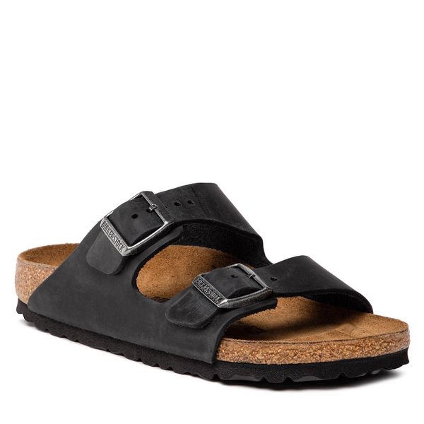 Klapki Birkenstock. Czarne klapki damskie Birkenstock, bez wzorów, bez obcasa. Za 539.99 zł.