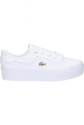 Tenisówki Lacoste Model Ziane Kolor Biały. Białe trampki i tenisówki damskie Lacoste, bez wzorów, ze skóry, klasyczne, bez zapięcia. Za 389.00 zł.